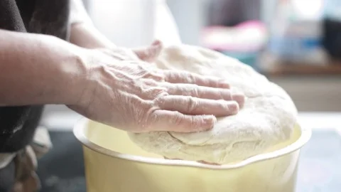 Chef kneads a large dough piece Stock Footage 74339246
