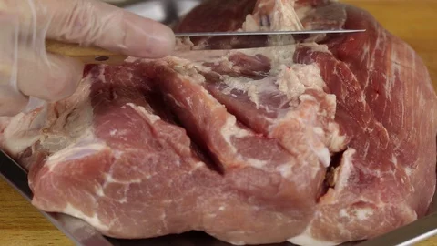 Chef with a knife cuts fat Stock Footage 122119015
