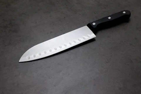 Chef knife on a dark gray table 스톡 사진