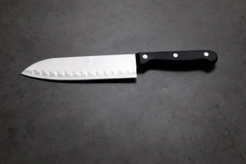Chef knife on a dark gray table 스톡 사진