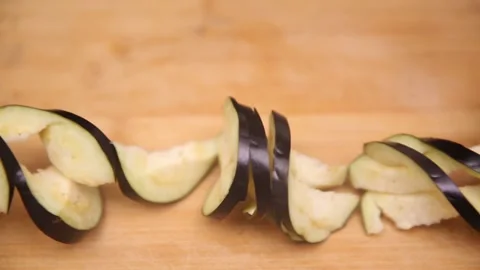 Chef knife demonstrates coir raincoat eggplant with knife eggplant (2) Stock Footage 202169246