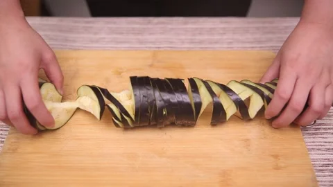 Chef knife demonstrates coir raincoat eggplant with knife eggplant (1) Stock Footage 202169248