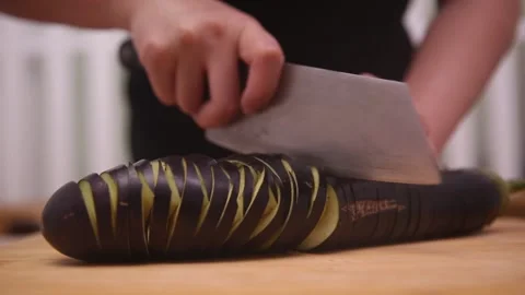 Chef knife demonstrates coir raincoat eggplant with knife eggplant (4) Stock Footage 202169255