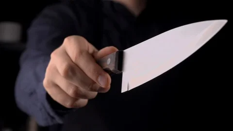 Chef with a knife in hands in the kitchen,cutting and cooking in slow motion Stock Footage 116495720