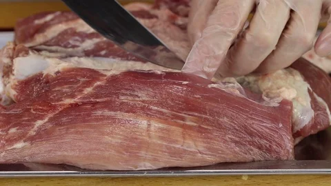 Chef with a knife separates a piece of pulp Stock Footage 122119006