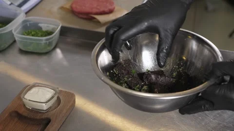 A chef laying deep-fried brown bread crackers with garlic on a wooden plate. Stock Footage 342702666