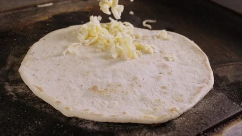The chef lays the cheese on the bread cake Video stock 171539342