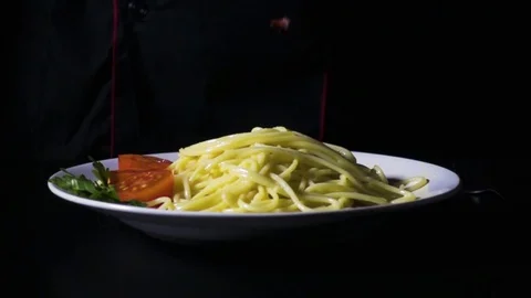 Chef lays out spaghetti pasta with bacon super slow motion Stock Footage 72433090