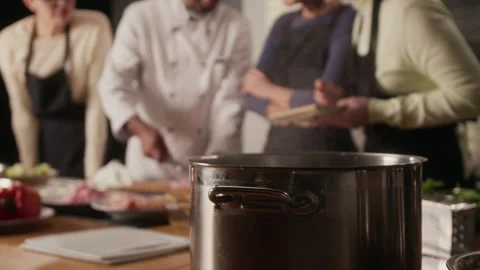 Chef Leading Cooking Master Class in Restaurant Stock Footage 332569696