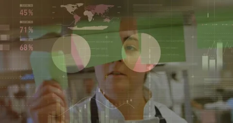 Chef lifting green note, scanning, placing on clear board while data charts Stock-Footage 331701250