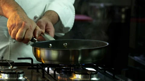 The chef Lights The Fire In The Brazier Stock Footage 145651425