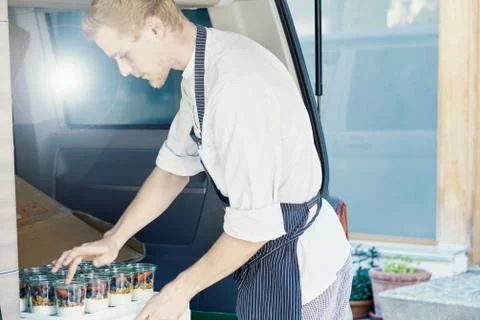 Chef loading food in van Stock Photos