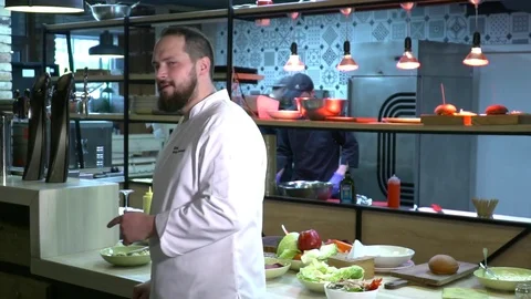 Chef looking to the camera and smiling slow motion Stock Footage 77043214