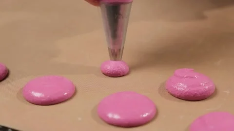 Chef make of a macaroons, pour the filling on the baking paper. Stock Footage 148536671