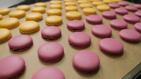 Chef make of a macaroons, prepared on the baking sheet to bake them. Stock Footage 148536721