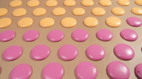 Chef make of a macaroons, prepared on the baking sheet to bake them. Stock Footage 148943225