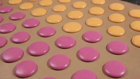 Chef make of a macaroons, prepared on the baking sheet to bake them. Stock Footage 149595461