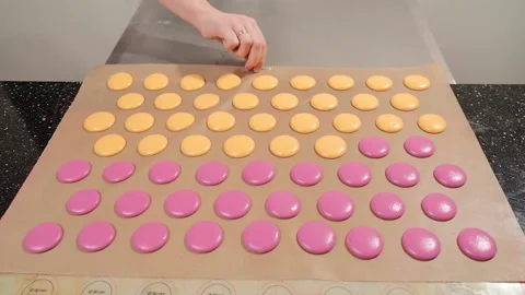 Chef make of a macaroons, prepared on the baking sheet to bake them. Stock Footage 150818948