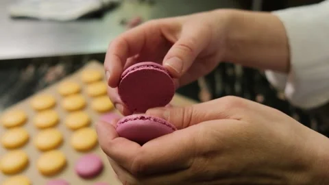 Chef make of a macaroons, prepared on the baking sheet after bake them. Stock Footage 156329356
