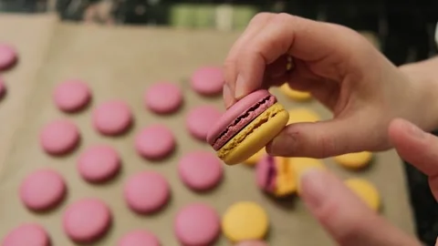 Chef make of a macaroons, prepared on the baking sheet after bake them. Stock Footage 222580470
