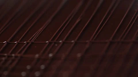 The chef makes a cake confectionery, laying thin chocolate lines on the surface Stock Footage 131230655