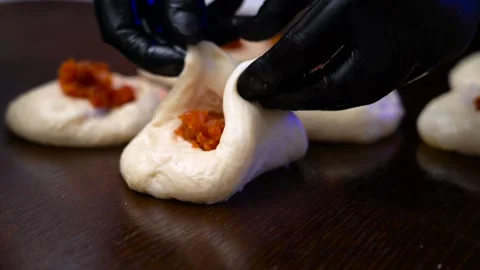 The chef makes donuts. Chef makes donuts with jam in the kitchen. Stock Footage 171666044