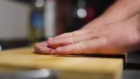 Chef makes, forms round burger patties, cutlet of ground beef Stock-Footage 332574325