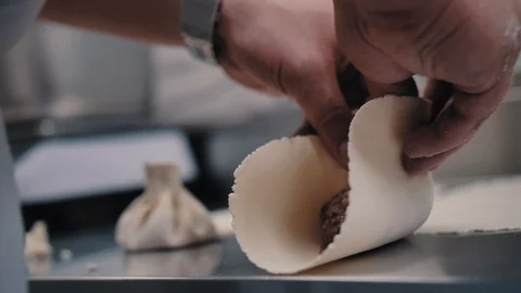 Chef makes khinkali in the kitchen Stock Footage 112594177