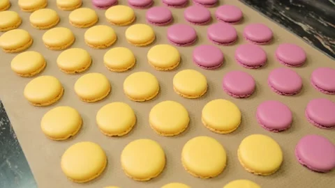 Chef makes of a macarons, the halves are fresh out of the roll. Stock Footage 148659864