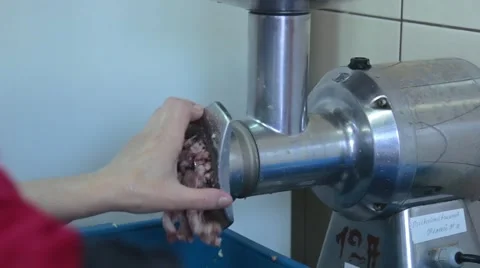 Chef makes mince in the meat grinder Stock Footage 58853489