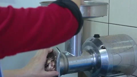 Chef makes mince in the meat grinder Video stock 143778507