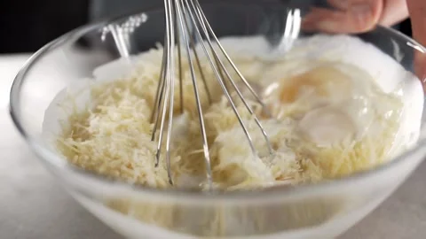 Chef makes omelet raw eggs and cream teasty breakfast Stock Footage 143778588