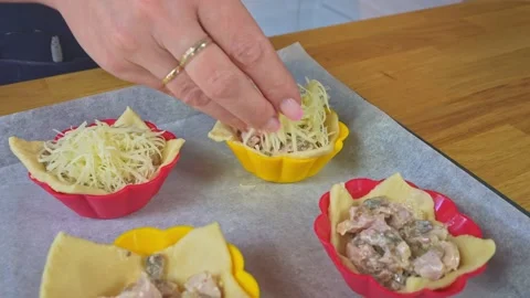The chef makes pies stuffed with ham and mushrooms and cheese on top. Stock Footage 160206481