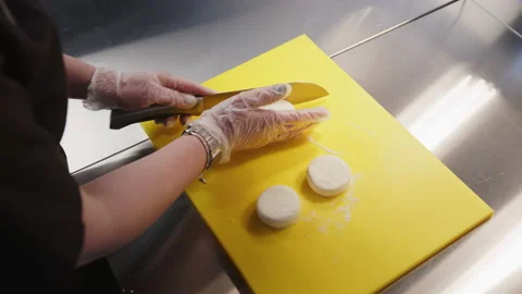 Chef makes Russian cheesecakes and gives it shape on the kitchen board. Cottage Stock Footage 153168613