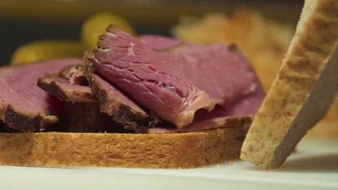 The chef makes a sandwich with dried meat Stock Footage 157981234