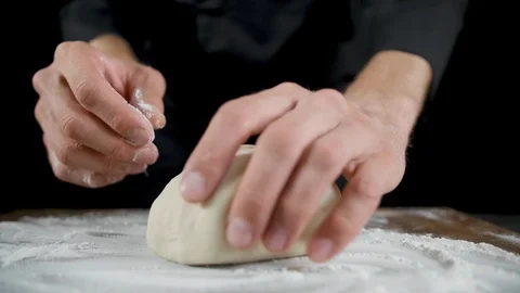 Chef makes scones from dough on a dark background Video stock 113513368