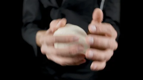 Chef makes scones from dough on a dark background Stock Footage 113514047