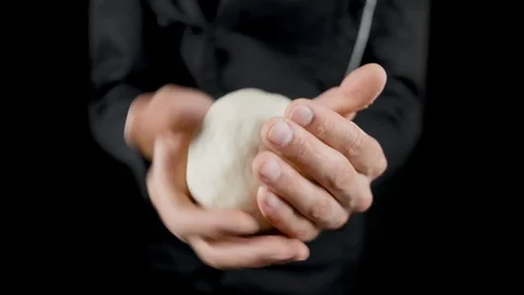 Chef makes scones from dough on a dark background Stock Footage 113514321
