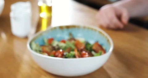 Chef makes warm salad in restaurant, serving vegetables in plate. Stock Footage 132967568