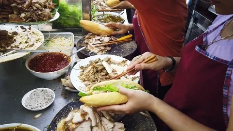Chef making Banh Mi Phuong in the Kitchen, A Favorite Local Homemade Bread in 库存影片 112661685