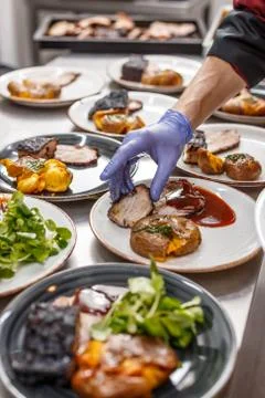 Chef is making a barbeque dish Stock Photos