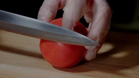 Chef making burger. Closeup mans hands cutting tomato for hamburger. Stock Footage 97574060