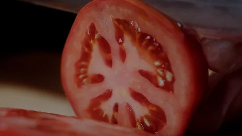 Chef making burger. Closeup mans hands cutting tomato for hamburger. Stock Footage 97574178