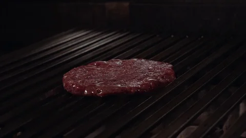 Chef making burger. Cooking hamburger. Beef or pork cutlet grilling on grid. 4K Stock Footage 97574912