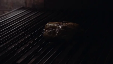 Chef making burger. Cooking hamburger. Beef or pork cutlet grilling on grid. 4K Stock Footage 97575589