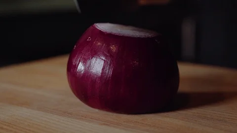 Chef making burger. Man slices the onion. Quick cutting of vegetables. Half Stock Footage 97573626