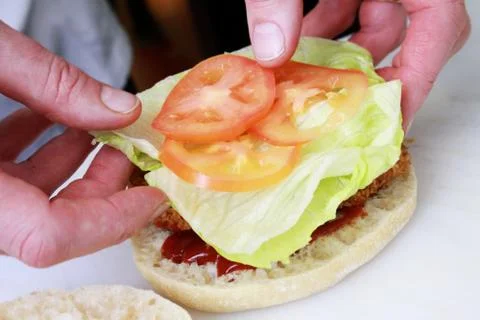 Chef making burger Stock Photos