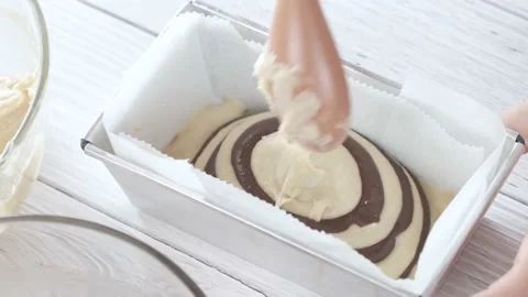 Chef making chocolate marble loaf cake. Stock Footage 167959492