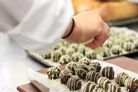 Chef making chocolate truffles Stock Photos