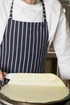 Chef making a crêpe Stock Photos